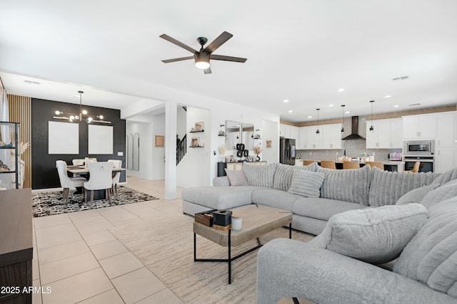 22501 E Indiana Ave, Queen Creek, AZ 85142 - tiled living room featuring ceiling fan with notable chandelier