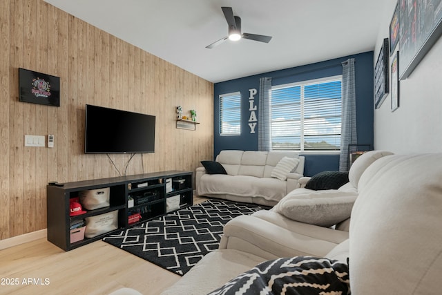 22501 E Indiana Ave, Queen Creek, AZ 85142 - living room featuring wooden walls, ceiling fan, and wood-type flooring