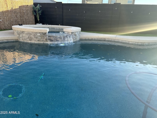 view of pool featuring pool water feature