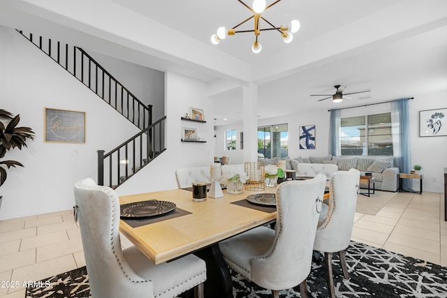 22501 E Indiana Ave, Queen Creek, AZ 85142 - dining room with tile patterned floors, a wealth of natural light, and ceiling fan with notable chandelier