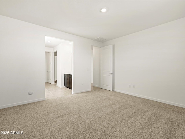 empty room with light colored carpet