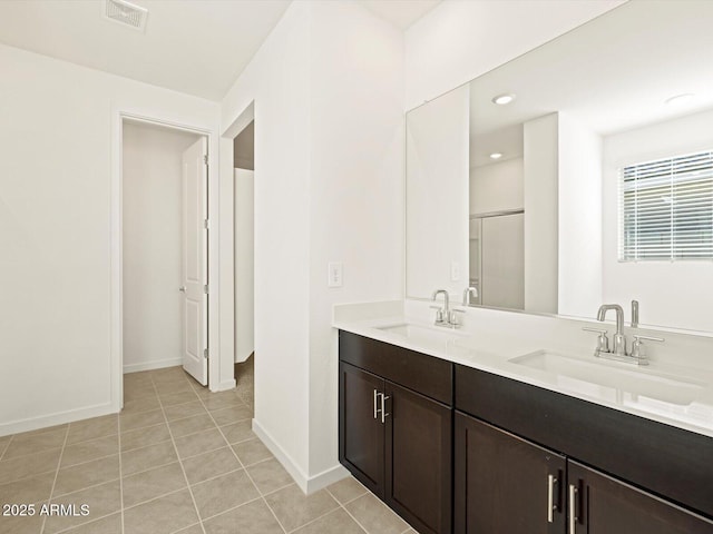 bathroom with vanity and tile patterned floors