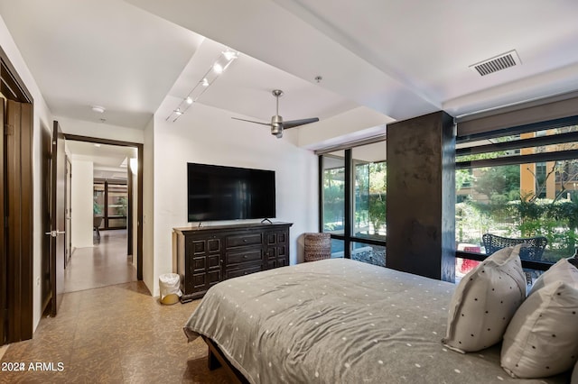 bedroom with access to exterior and ceiling fan