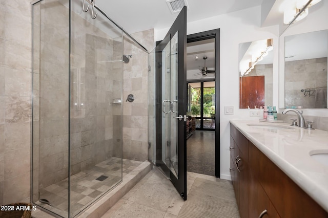 bathroom with vanity and a shower with shower door