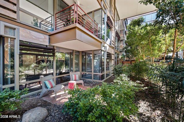 view of patio with a sunroom