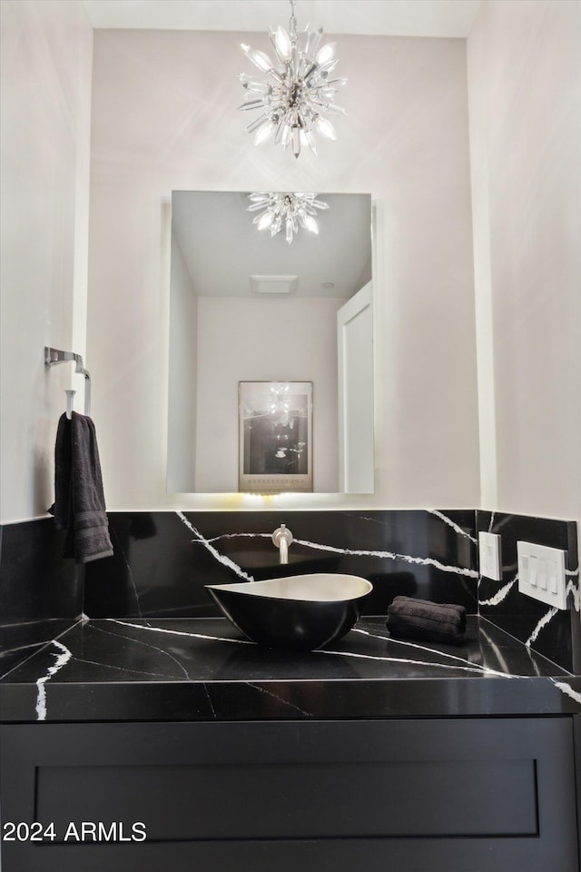 bathroom featuring vanity and an inviting chandelier