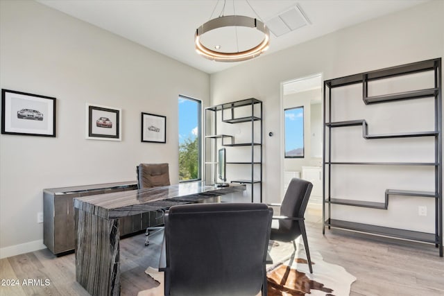 office area with light hardwood / wood-style flooring