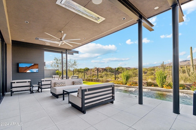 view of patio / terrace with an outdoor living space and ceiling fan