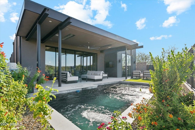 rear view of house with a jacuzzi, an outdoor hangout area, a patio area, and ceiling fan