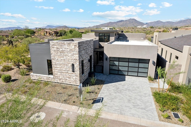 view of front of house with a mountain view and a garage