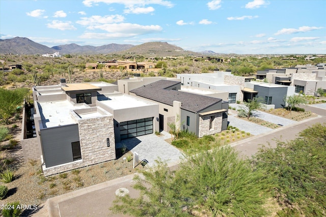 drone / aerial view featuring a mountain view