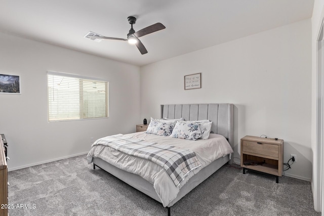 carpeted bedroom with visible vents, a ceiling fan, and baseboards