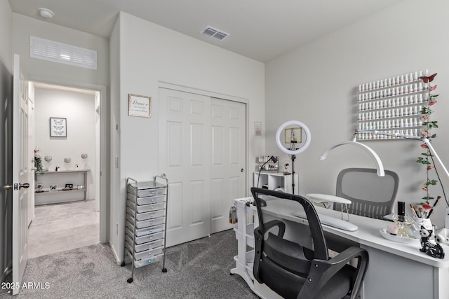 office space featuring visible vents and carpet flooring