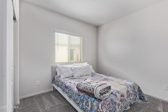 bedroom featuring carpet flooring and baseboards