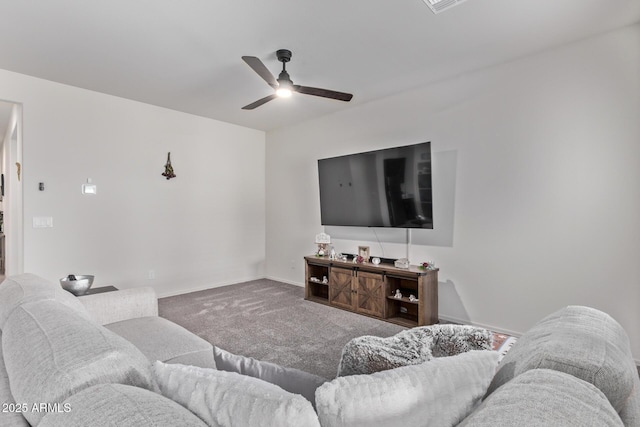 carpeted living area with visible vents, baseboards, and ceiling fan