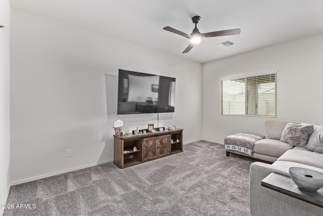 living room featuring visible vents, baseboards, carpet, and a ceiling fan