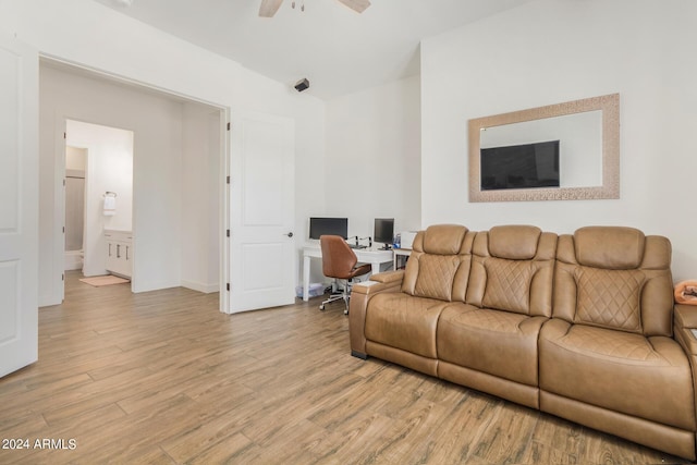 living room with ceiling fan and light hardwood / wood-style floors