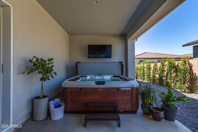 view of patio with a hot tub