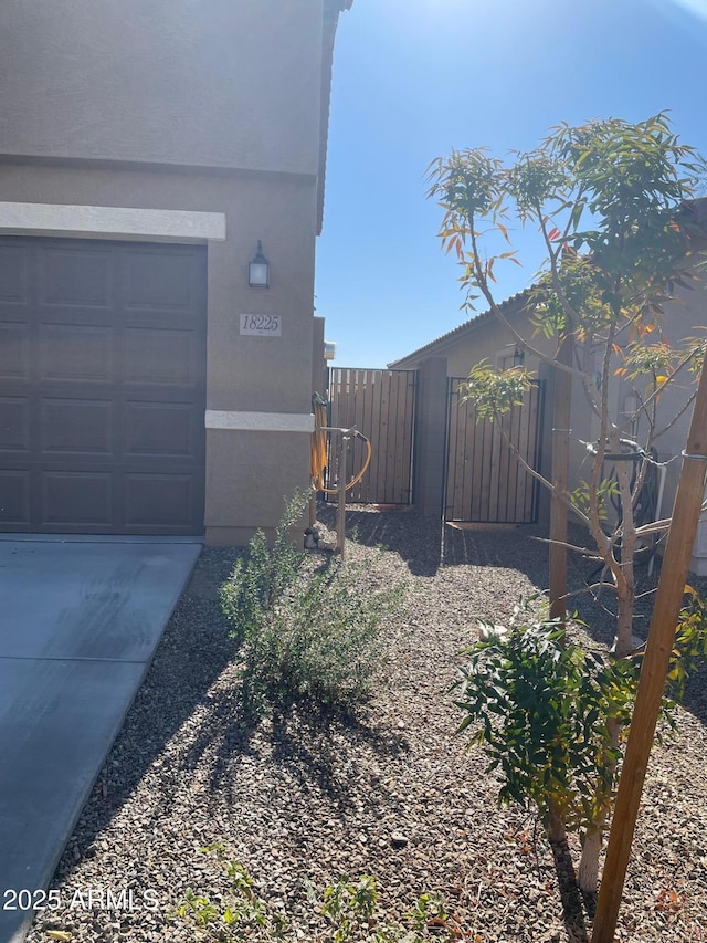 view of property exterior featuring a garage