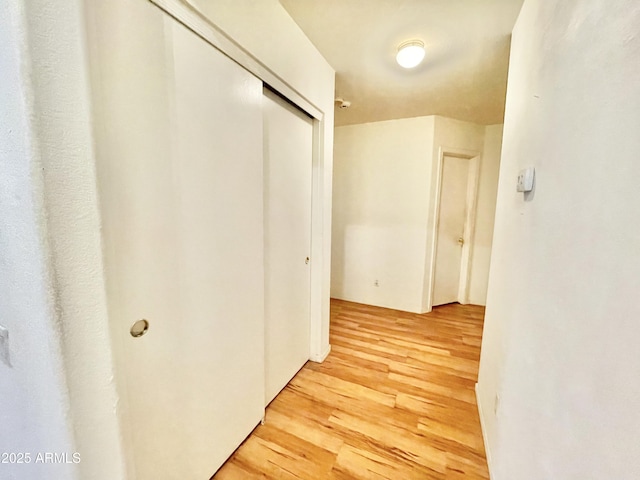 hall with light wood-style flooring