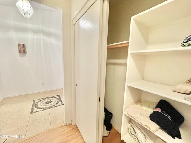 spacious closet featuring tile patterned flooring