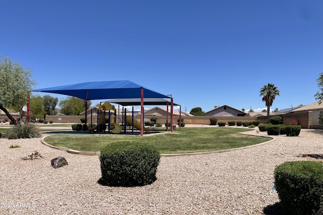 communal playground featuring a yard