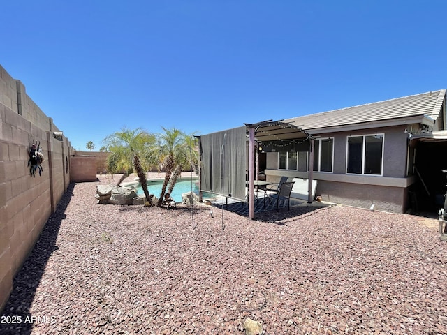 fenced backyard featuring a pergola and a patio area