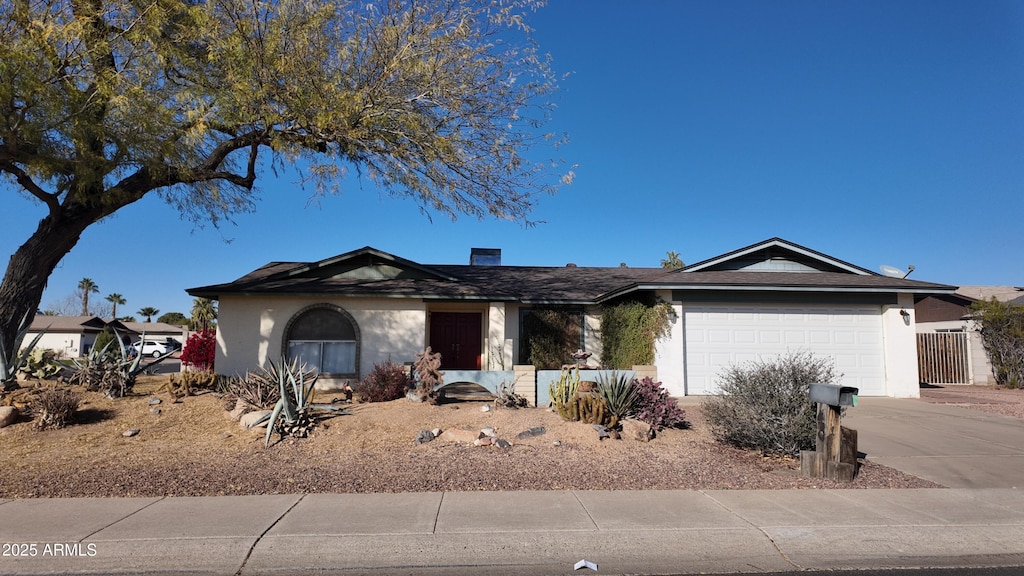 single story home with a garage