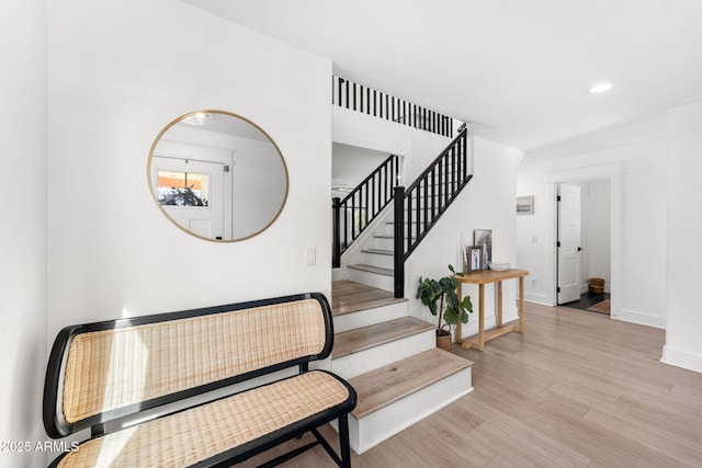 staircase featuring hardwood / wood-style floors