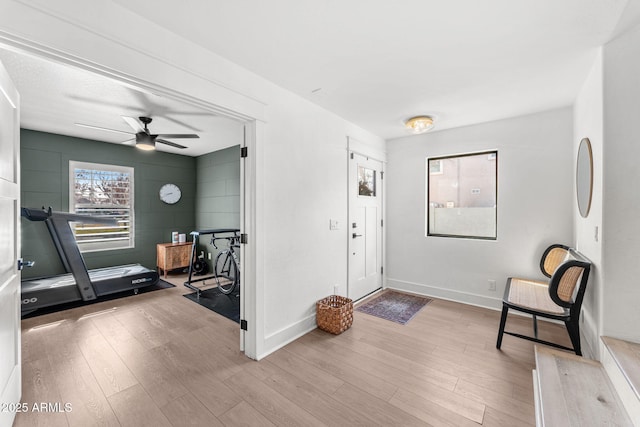 entrance foyer featuring ceiling fan and light hardwood / wood-style flooring