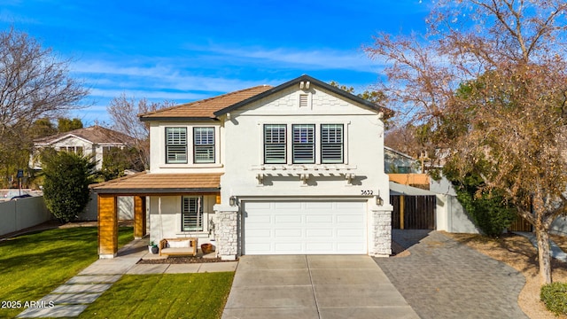 view of front of property with a garage and a front yard