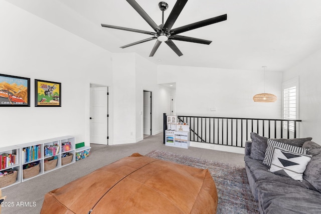 carpeted living room featuring high vaulted ceiling and ceiling fan