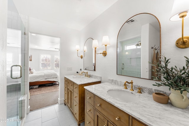 bathroom featuring vanity, tile patterned floors, and walk in shower