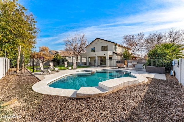 view of swimming pool with a patio area and an in ground hot tub