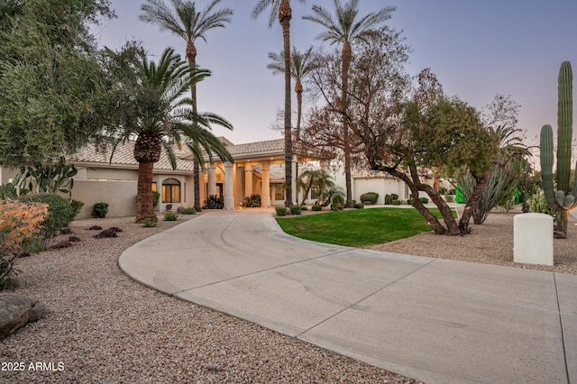 view of front of house with a lawn