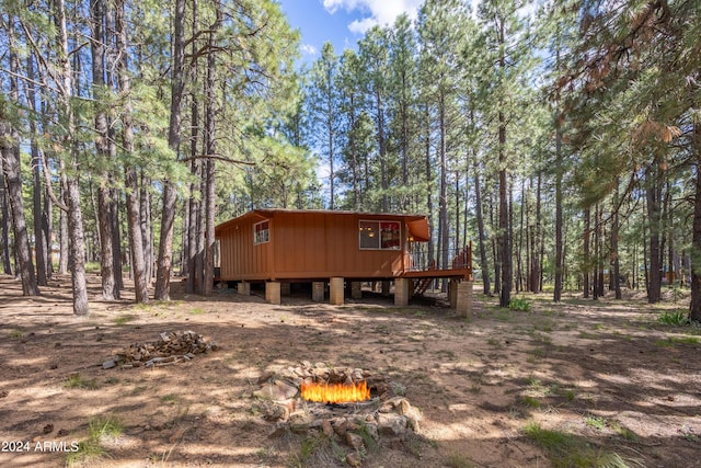 1423 Geode Dr, Forest Lakes, AZ 85931 - view of front of house with an outdoor fire pit and a deck
