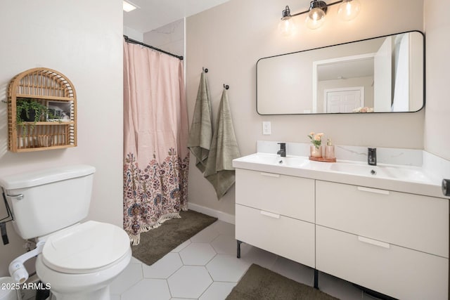 bathroom featuring tile patterned floors, vanity, a shower with shower curtain, and toilet