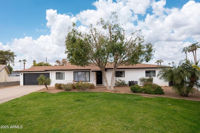 ranch-style house with a garage and a front lawn