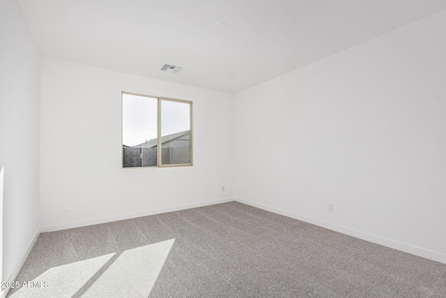 empty room featuring carpet floors