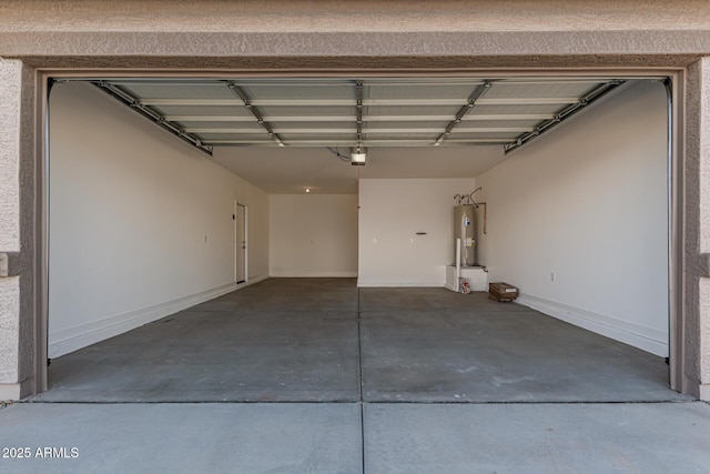 garage featuring water heater and a garage door opener