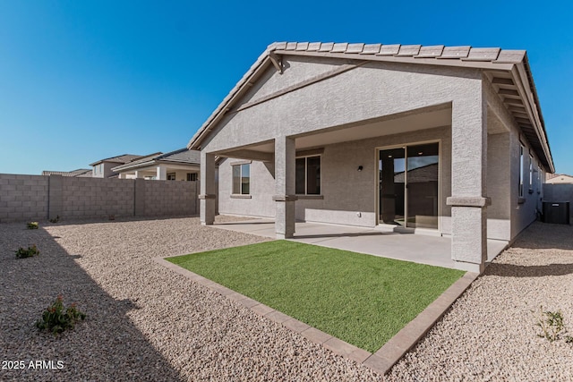 back of house with a patio area