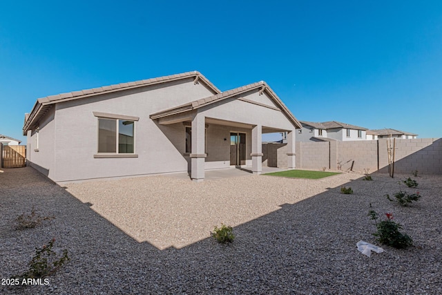 rear view of property with a patio