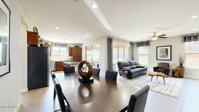 dining area featuring light tile patterned flooring, baseboards, ceiling fan, and recessed lighting