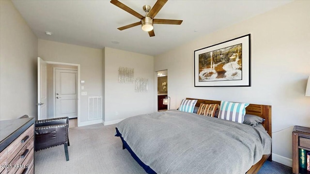 bedroom featuring baseboards, visible vents, carpet, and a ceiling fan