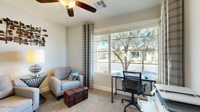 office area featuring baseboards, ceiling fan, and plenty of natural light
