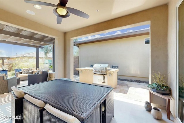 view of patio / terrace with area for grilling and a ceiling fan