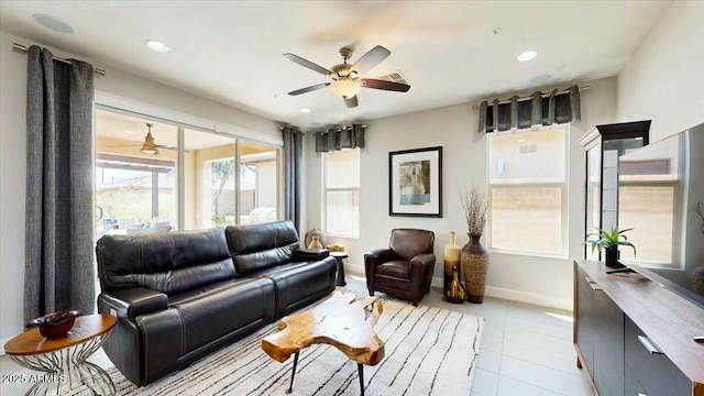 tiled living area featuring baseboards, visible vents, recessed lighting, and a ceiling fan