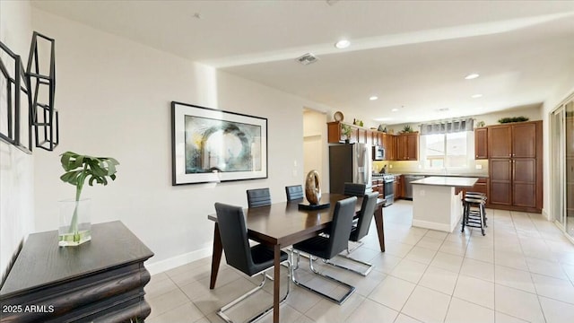 dining space featuring light tile patterned flooring, baseboards, visible vents, and recessed lighting
