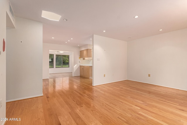 unfurnished living room featuring light wood-type flooring