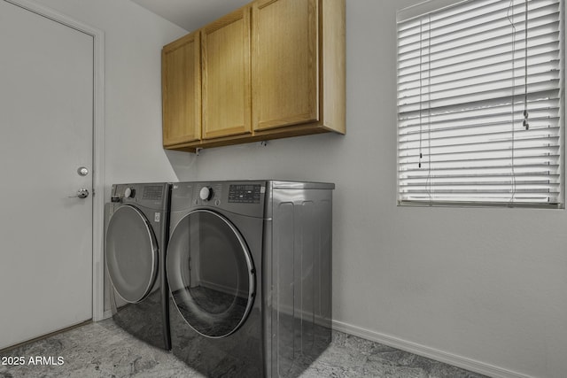 4530 E Desert Wind Dr, Phoenix, AZ 85044 - laundry room with cabinet space, washing machine and dryer, and baseboards